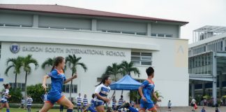 Soccer players running on SSIS field